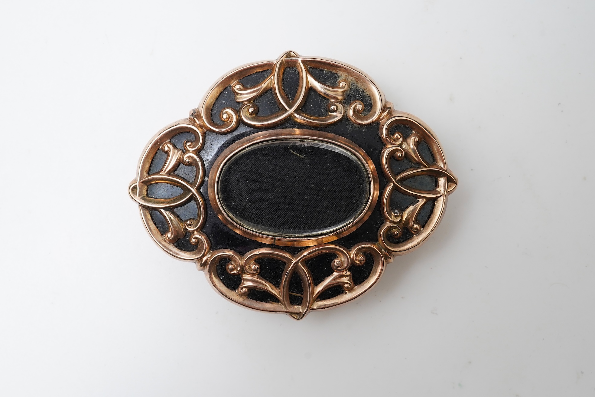 A Victorian rolled gold and enamel locket brooch/pendant, late 19th century